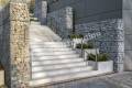 Modern concrete staircase with gabion fence as an eye-catcher